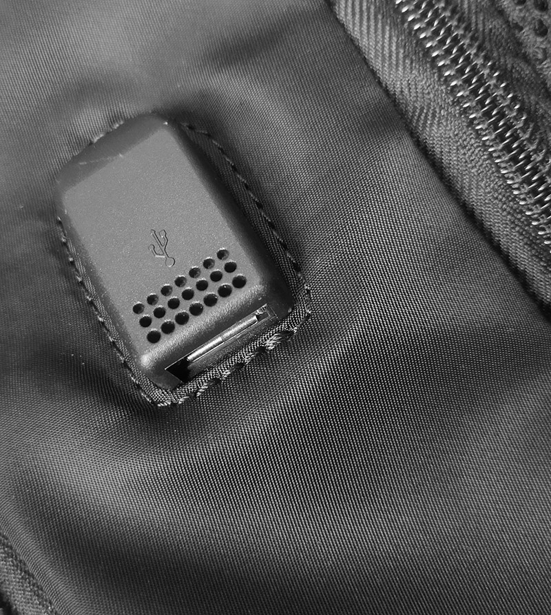 a black device in a black bag